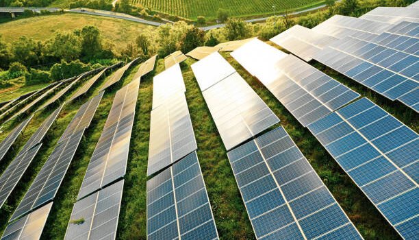 Solar panels fields on the green hills